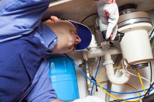 plumber fixing Garbage Disposal in Oklahoma City in an emergency